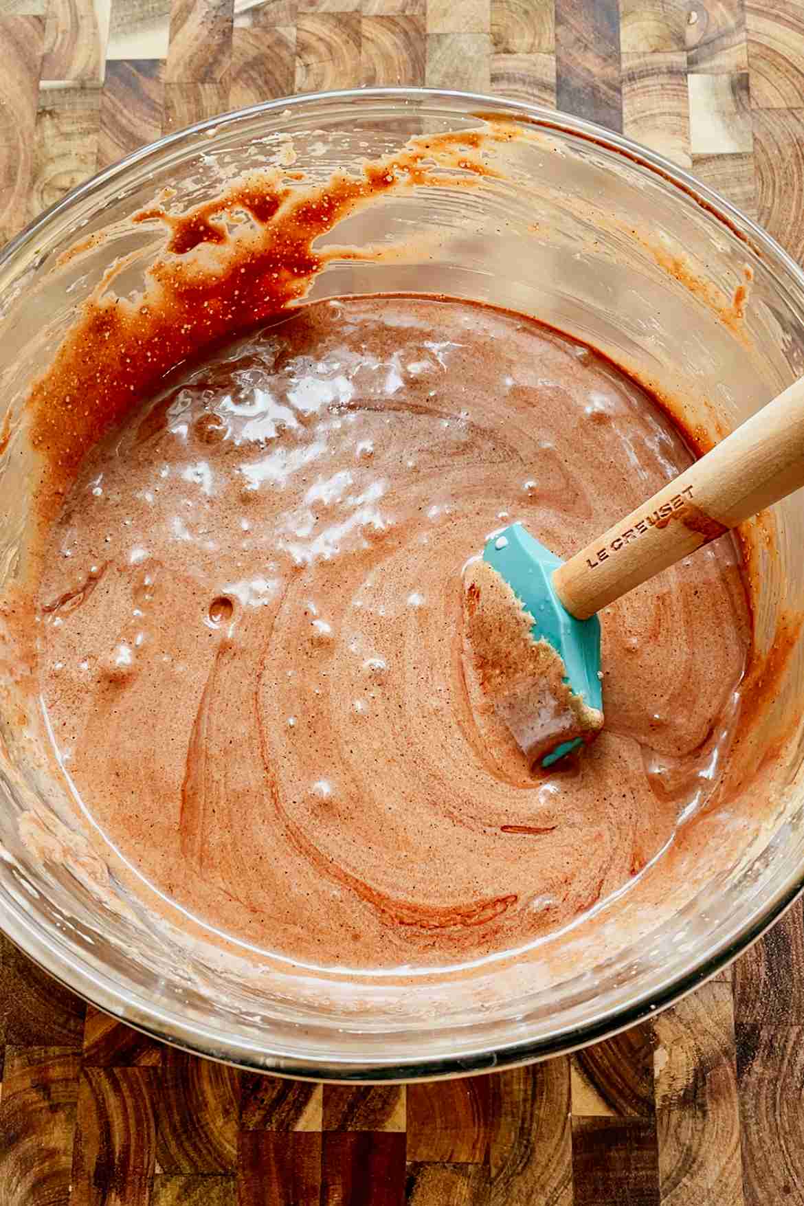 Sourdough brownie batter mixed with chocolate and brown butter in a bowl