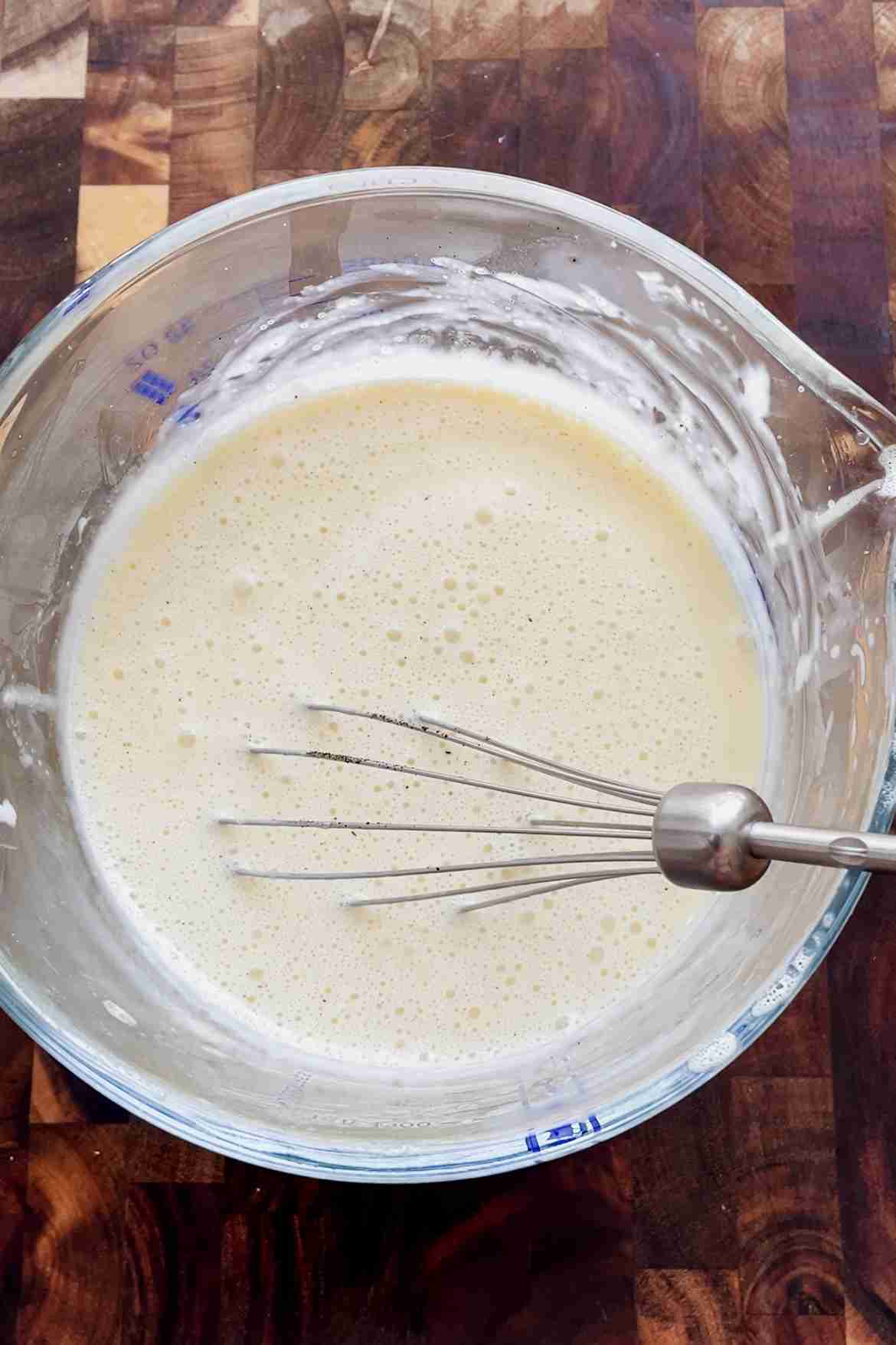 adding vanilla bean powder to vanilla custard