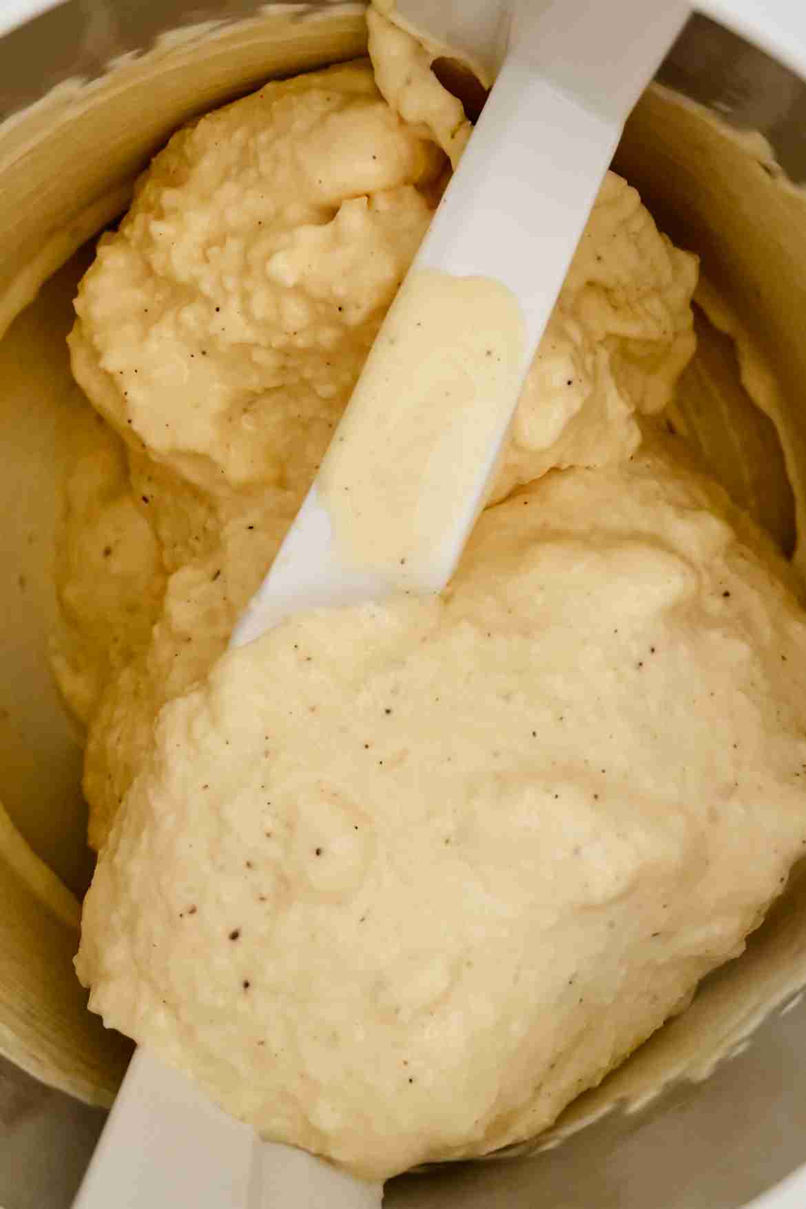 Vanilla custard ice cream churning in an ice cream maker