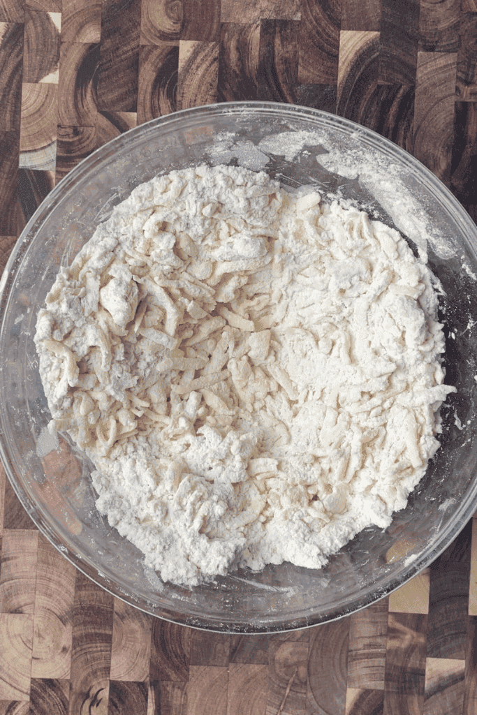 Cold butter grated into fine shreds for express sourdough puff pastry