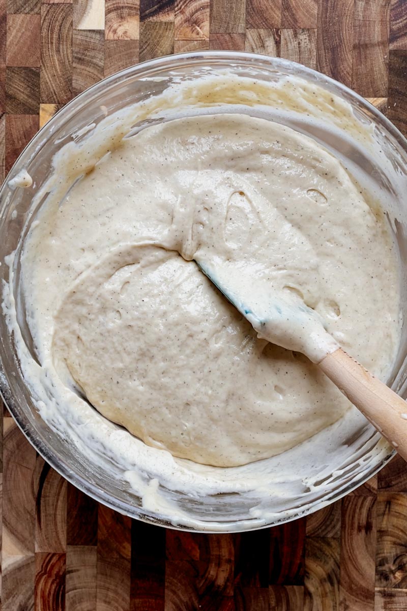 gently mixing fluffy sourdough pancake batter with spatula