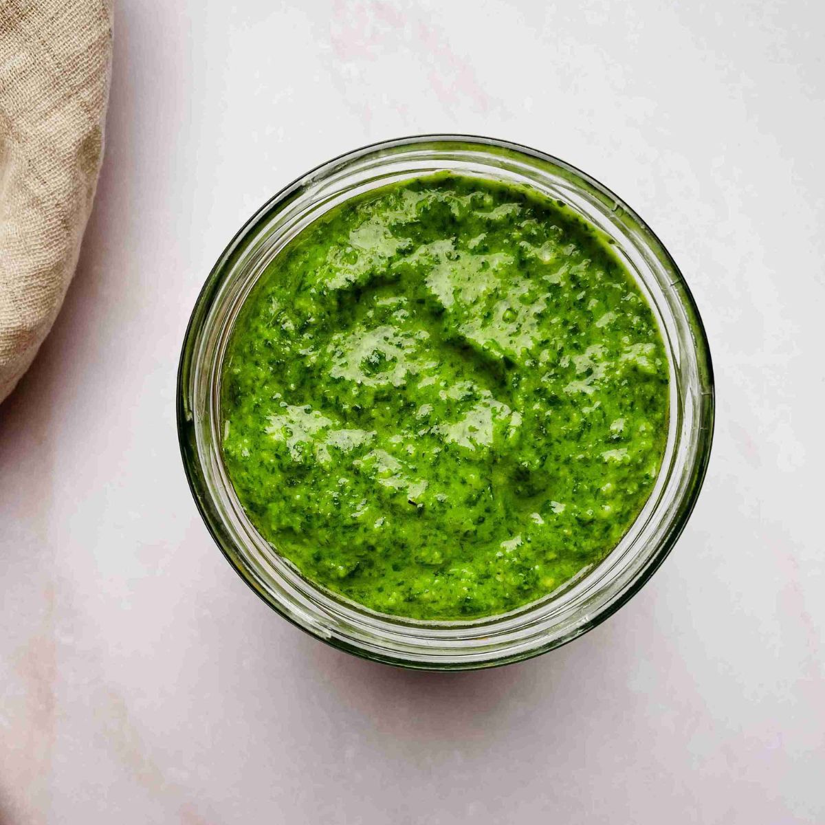 pesto sauce without pine nuts made with cashews in a bowl with fresh basil