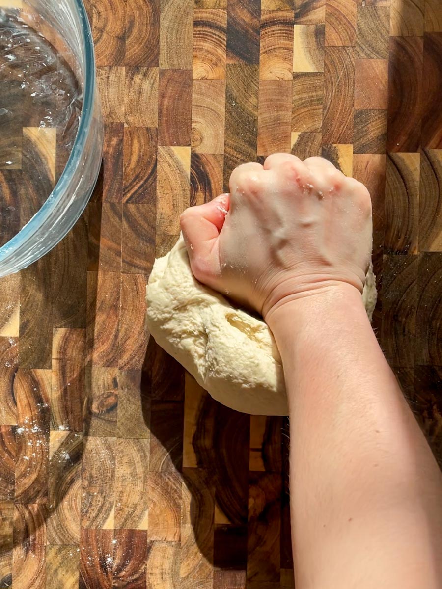 kneading sourdough discard pizza dough by hand