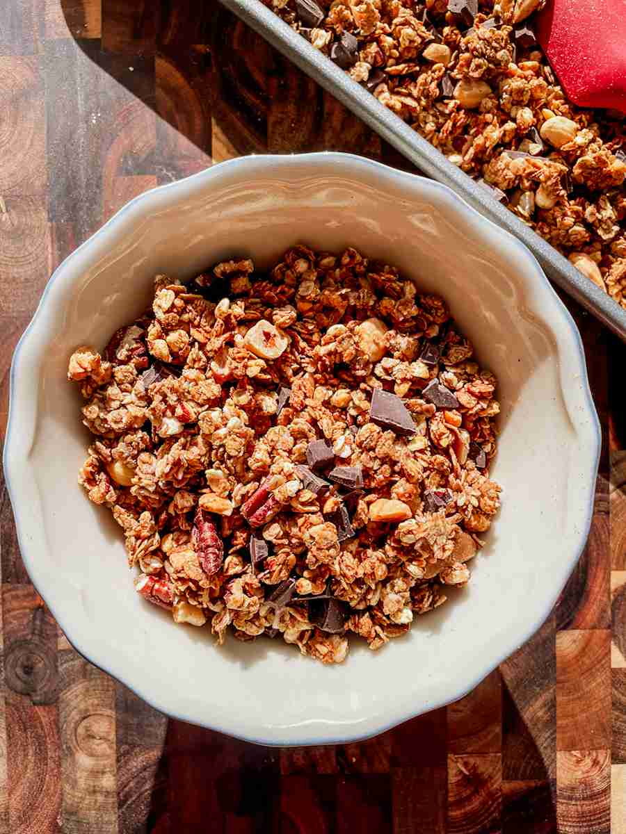 Crunchy sourdough discard granola clusters with brown butter and dark chocolate chunks